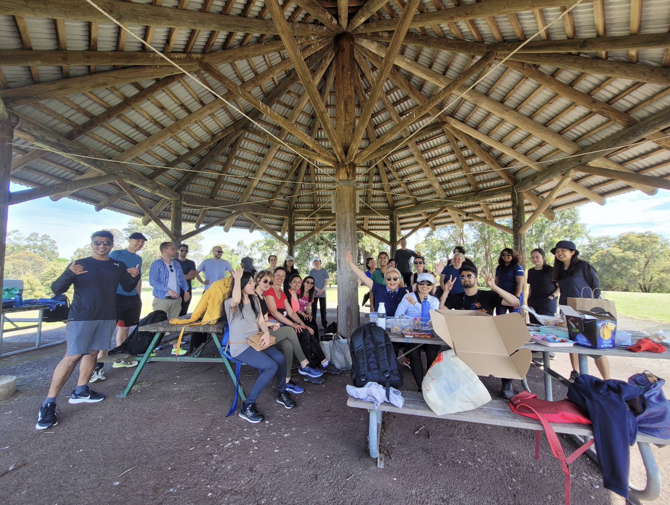 Community gathering beneath a pavilion before MANZU